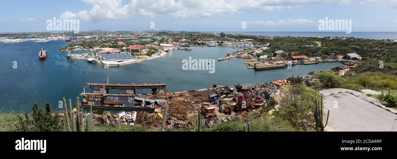 A metal recycling area in the harbor of Willemstad, capital of the Caribbean island nation of Curacao in the Schottegat lagoon, a large natural lagoon Stock Photo