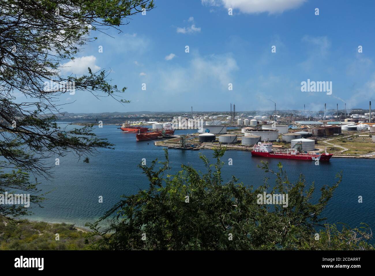 The Isla Oil Refinery in the harbor of Willemstad, capital of the Caribbean island nation of Curacao in the Schottegat lagoon, a large natural lagoon Stock Photo