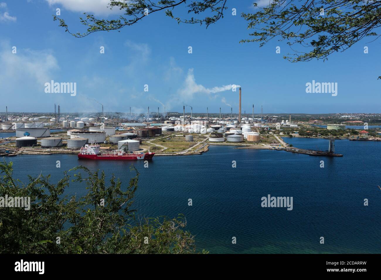 The Isla Oil Refinery in the harbor of Willemstad, capital of the Caribbean island nation of Curacao in the Schottegat lagoon, a large natural lagoon Stock Photo