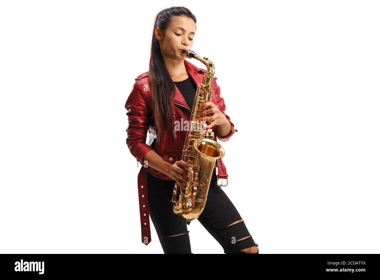 Young female saxophonist in a red leather jacket playing sax isolated on white background Stock Photo