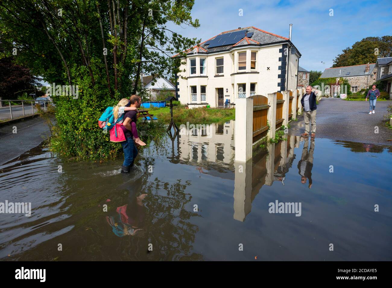 Par, Cornwall, UK. 27/08/2020. The front garden if a house is submerged after torrential rain and high tides overwhelm the drainage systems. Stock Photo