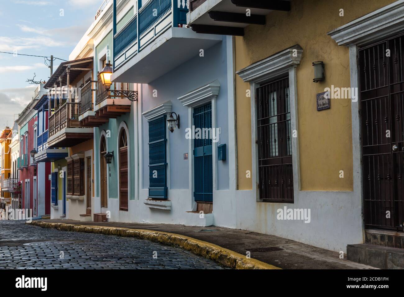 Colorfully painted houses on a narrow cobblestone street in the