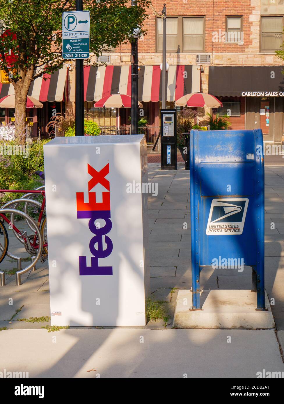 Federal Express package dropbox and U.S. Postal Service mailbox. Oak