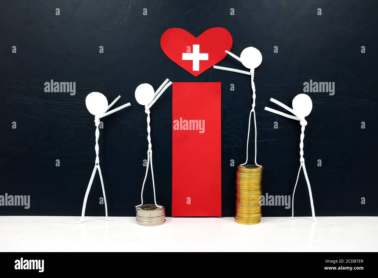 Stick figure reaching for a red heart shape with cross cutout while stepping on stack of coins. Healthcare, medical care and hospital access inequality. Stock Photo