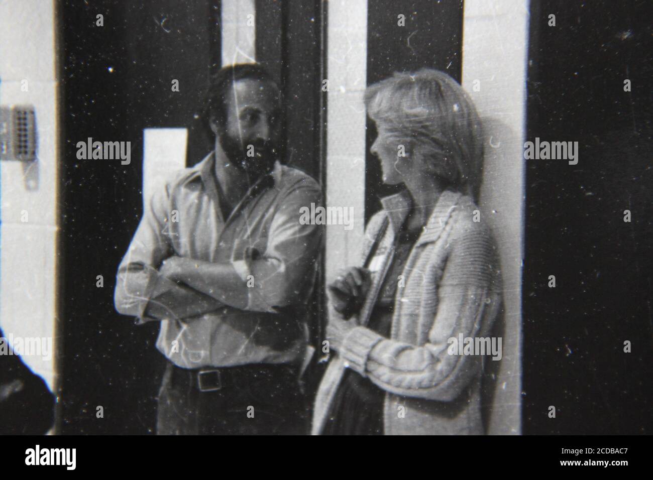 Fine 1970s vintage black and white photography of two regular adults talking with each other. Stock Photo