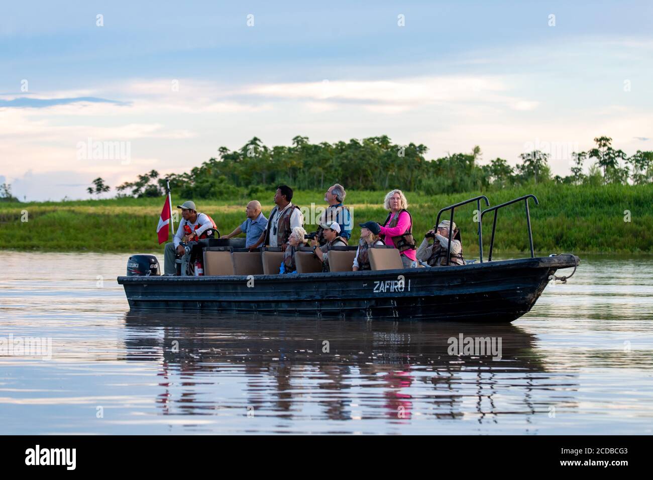 As boat safari from the expeditionary cruise Zafiro looks for wildlife  along the Peruvian Amazon Stock Photo - Alamy