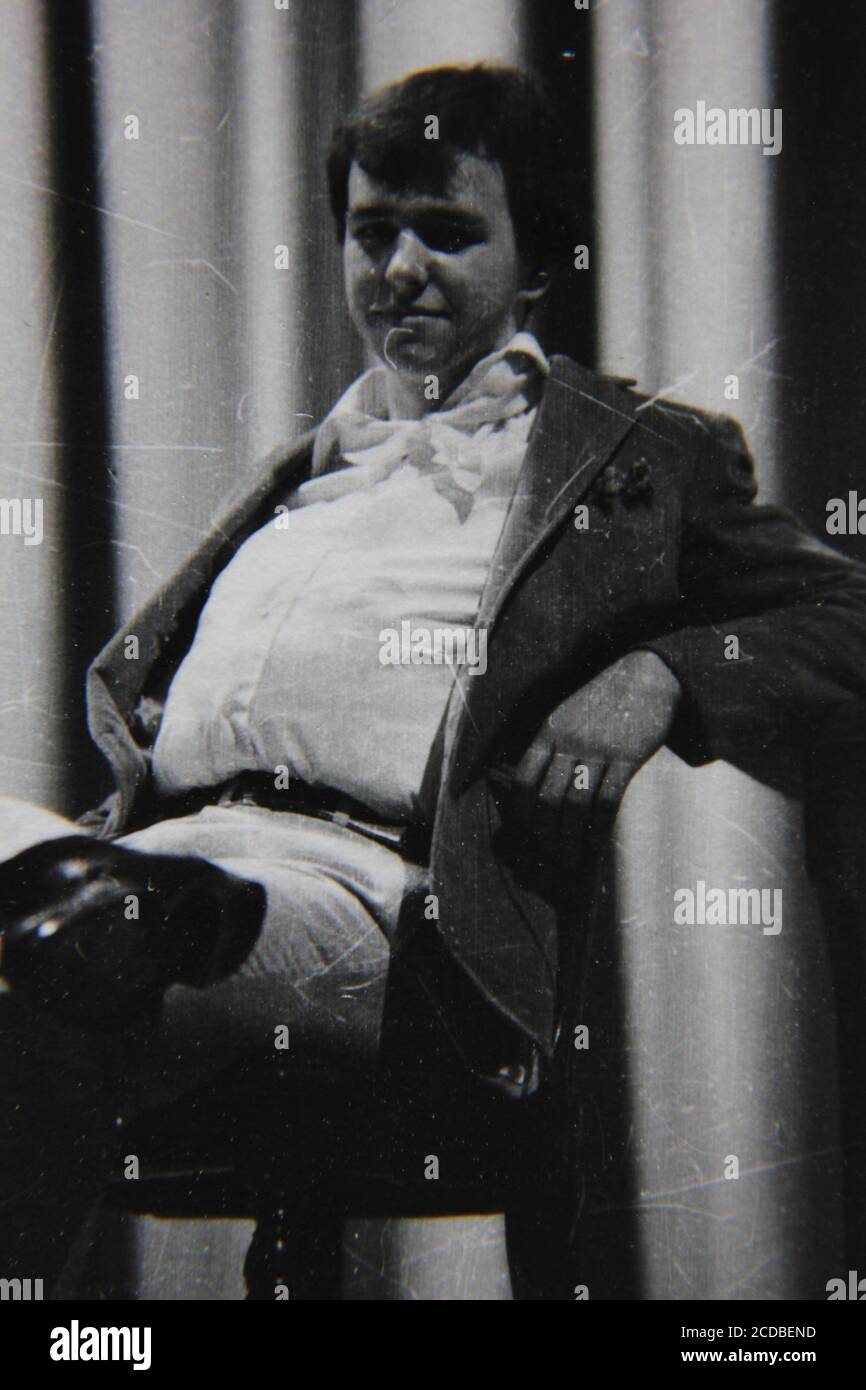 Fine 1970s vintage black and white photography of a young laid back man ...
