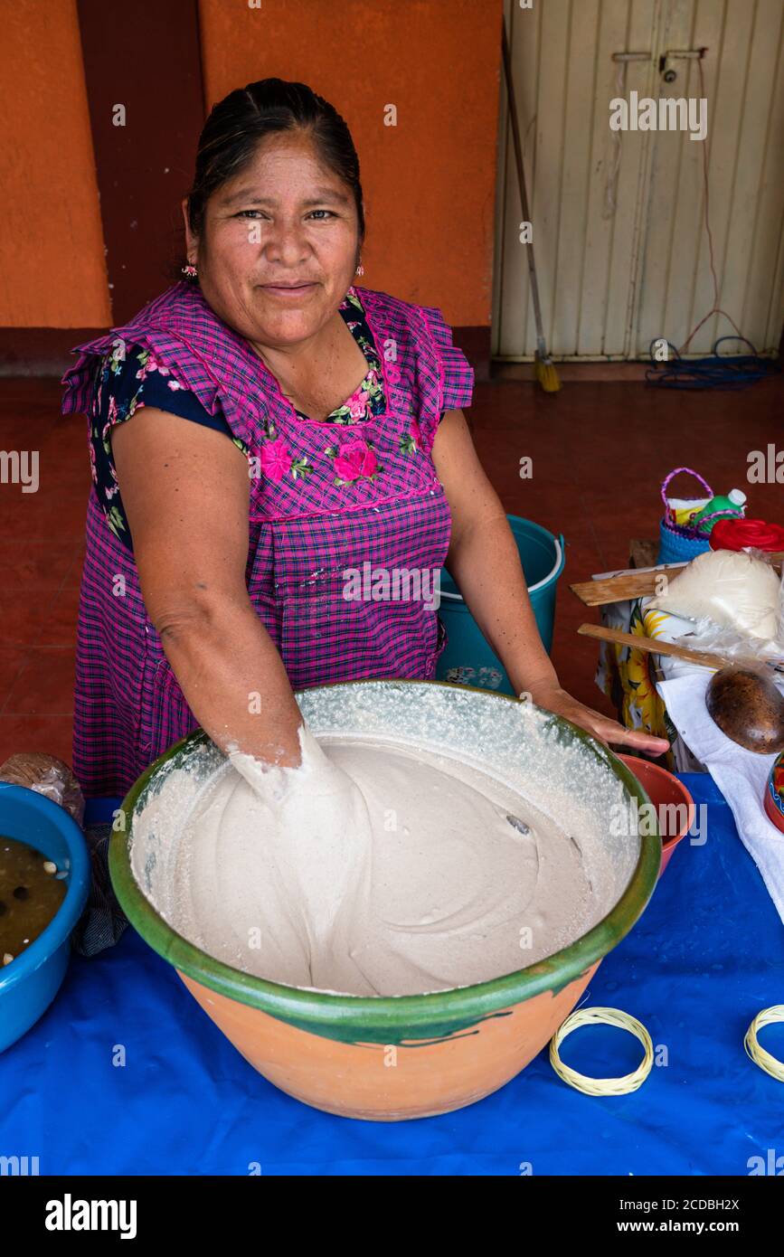 A Zapotec woman makes tejate, a traditional drink in Oaxaca, Mexico.  Principal ingredients are toasted maize, fermented cacao beans, toasted mamey pi Stock Photo