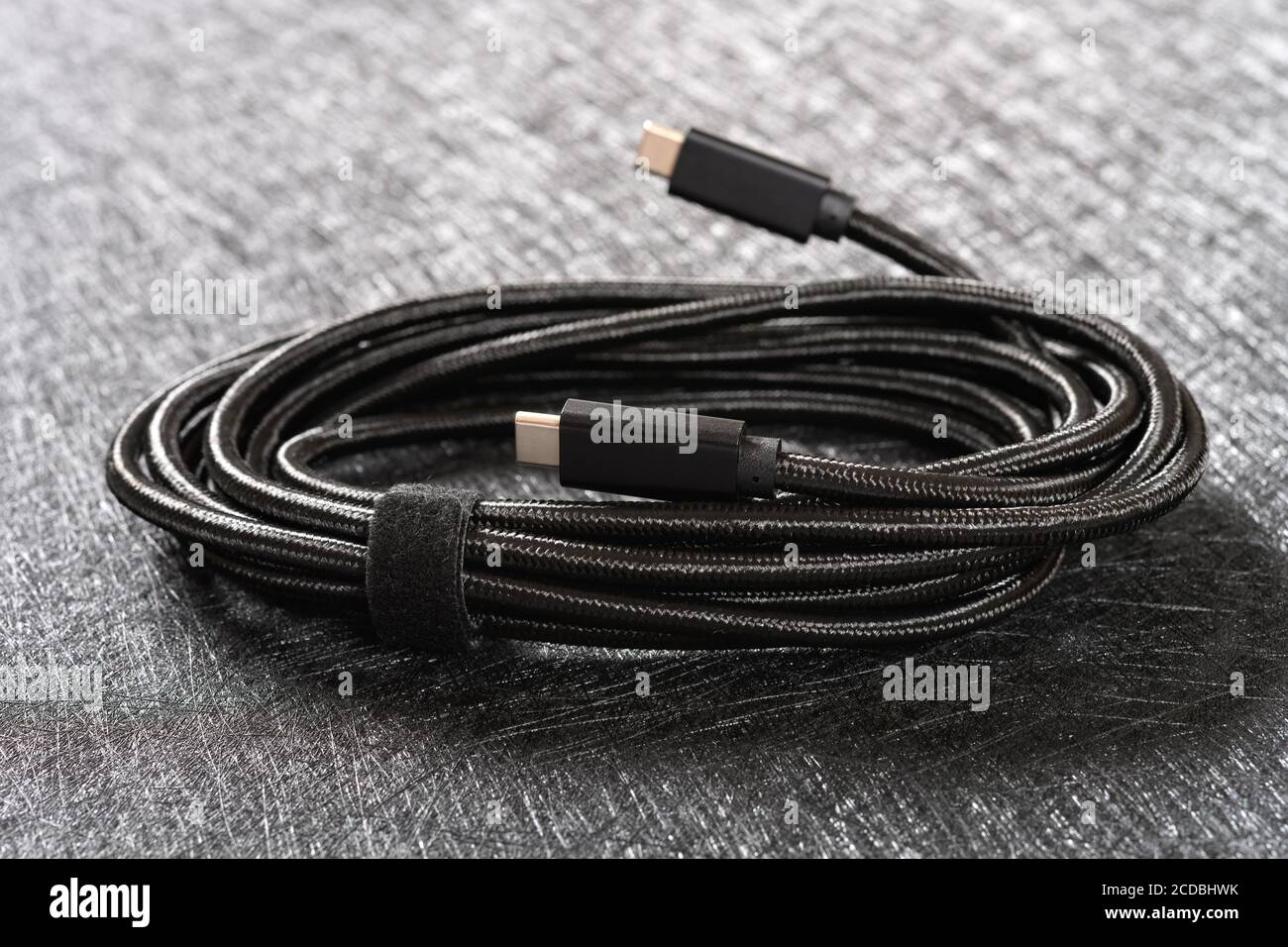 black type C cable on a dark background Stock Photo