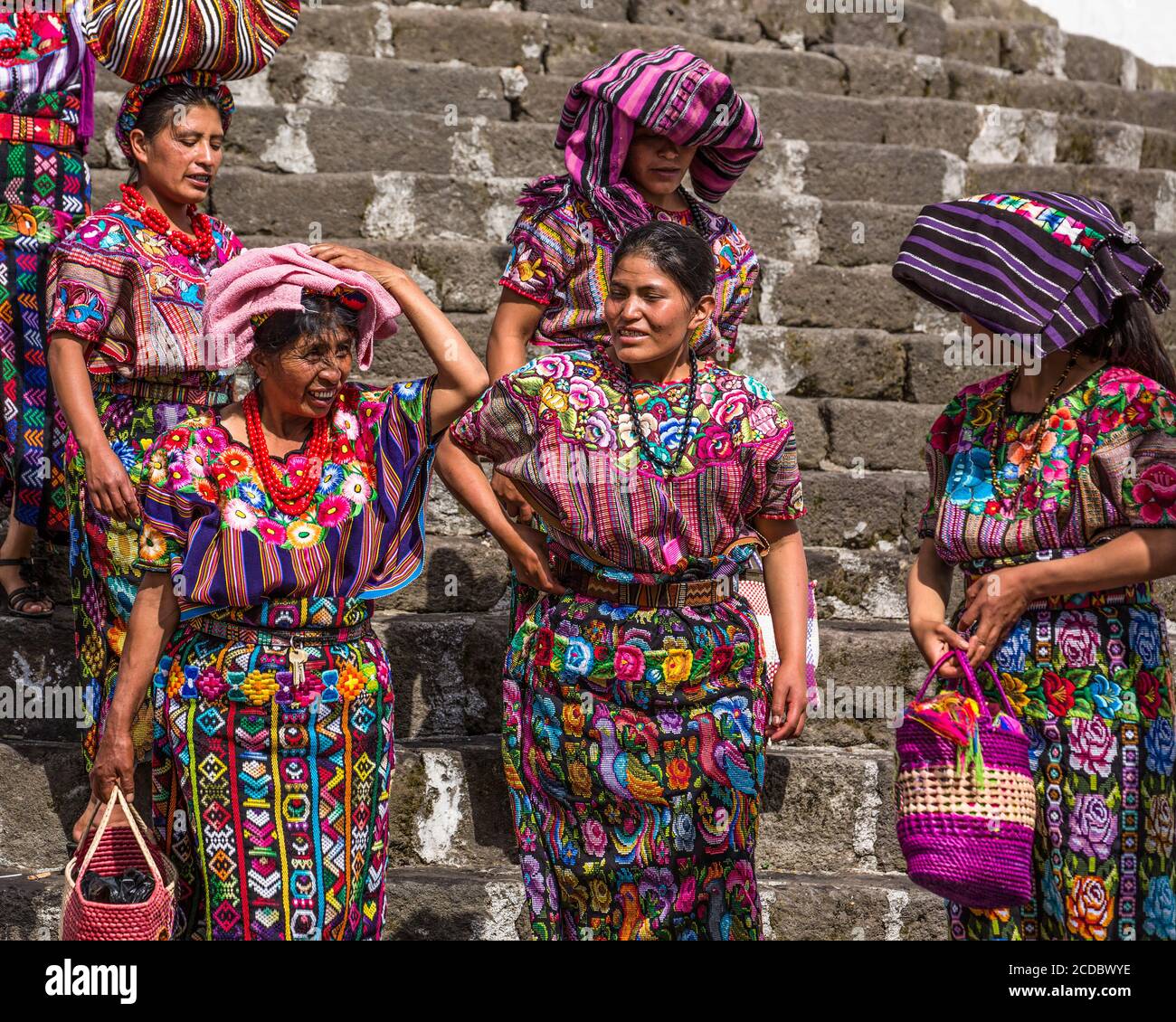 Mayan Indians in traditional dress leave the Church of Santiago after mass in Santiago Atitlan, Guatemala. Stock Photo