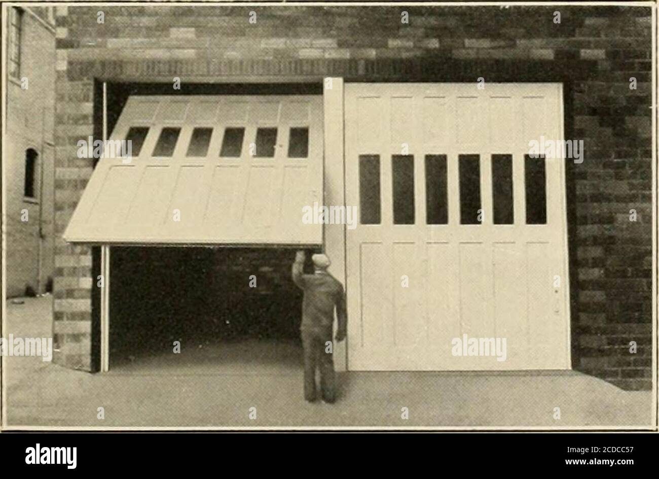 Over The Top Door Equipment For Operating Vertical Doors Overhead Over The Top Door Equipment Installed On Agreasing Station Door Comprised Of Four Sections Andmeasuring 16 X 12 I 1 1 N Ihhi I