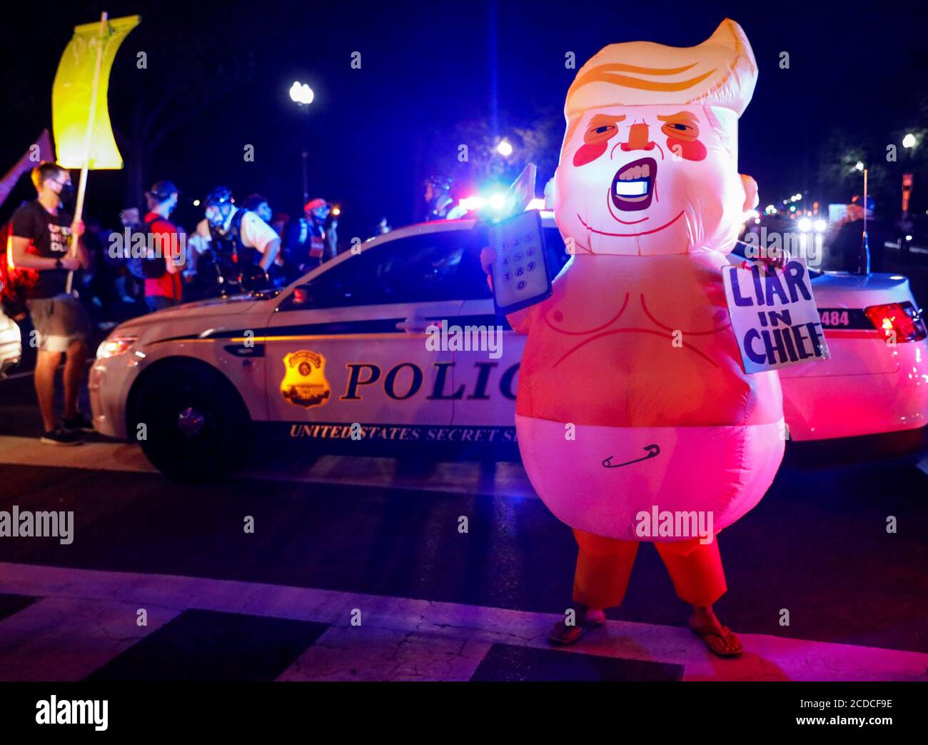 An Inflatable Costume Depicting U S President Donald Trump As A Baby Is Pictured During A Protest As Security Officers Block The Path On Constitution Avenue In Washington U S August 27 2020 Reuters Andrew