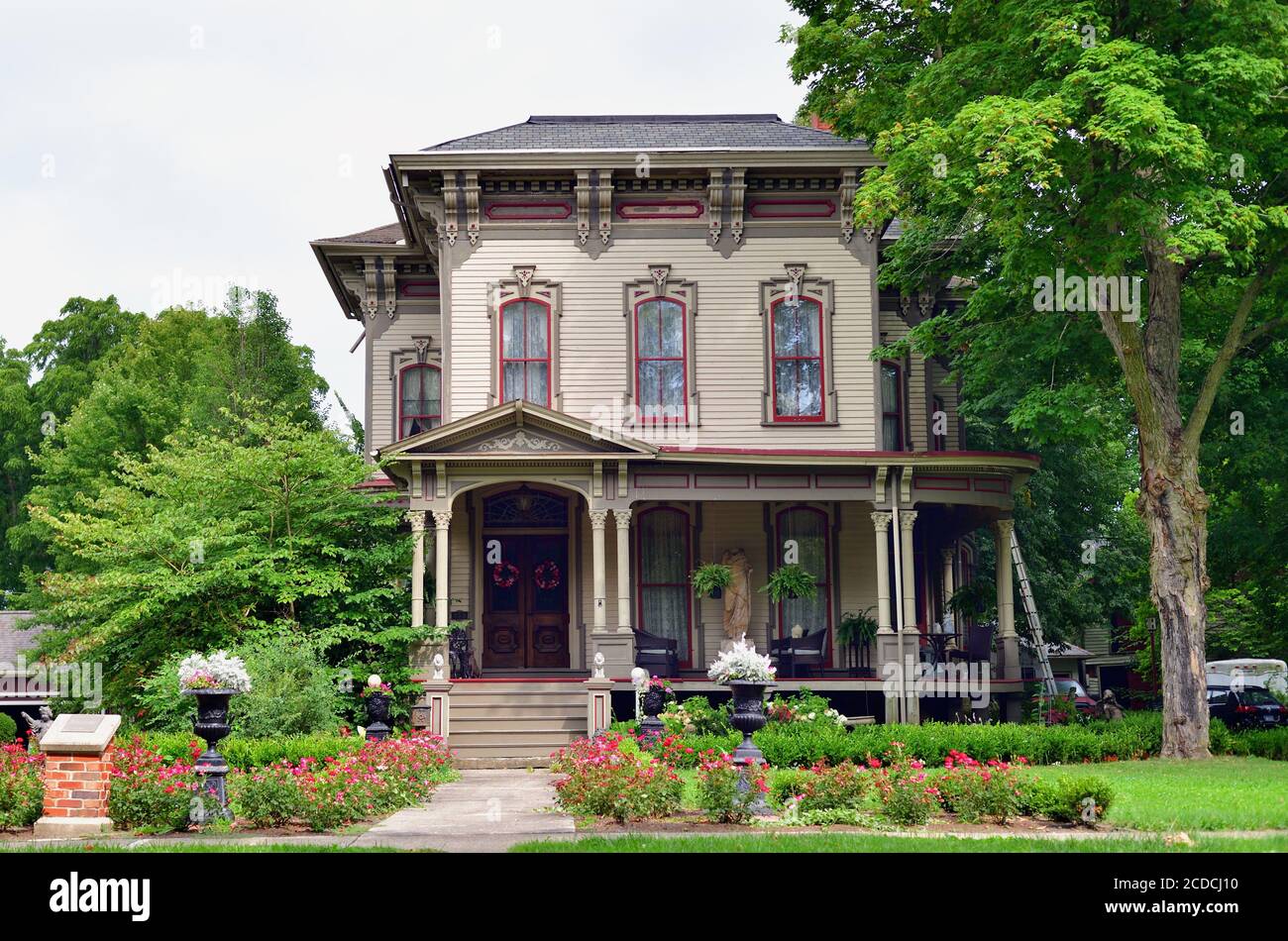 Sycamore, Illinois, USA. A beautifully restored and maintained home with a wrap around porch and extensive landscaping. Stock Photo