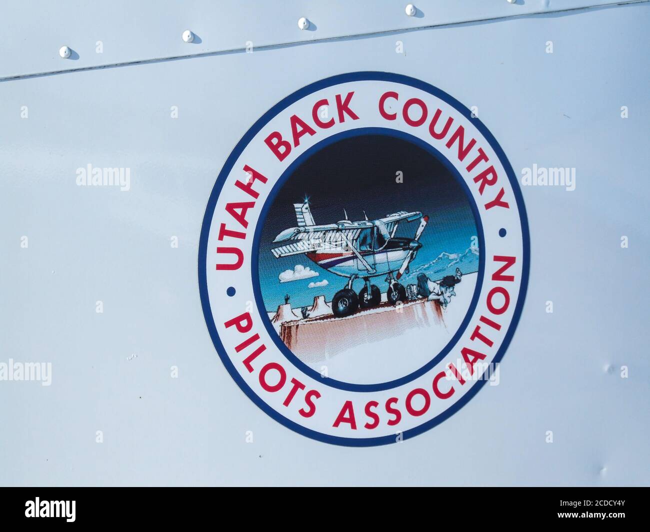 The logo of the Utah Backcountry Pilots Association painted on the tail of a Cessna 185 Skywagon at a remote backcountry airstrip near Moab, Utah. Stock Photo