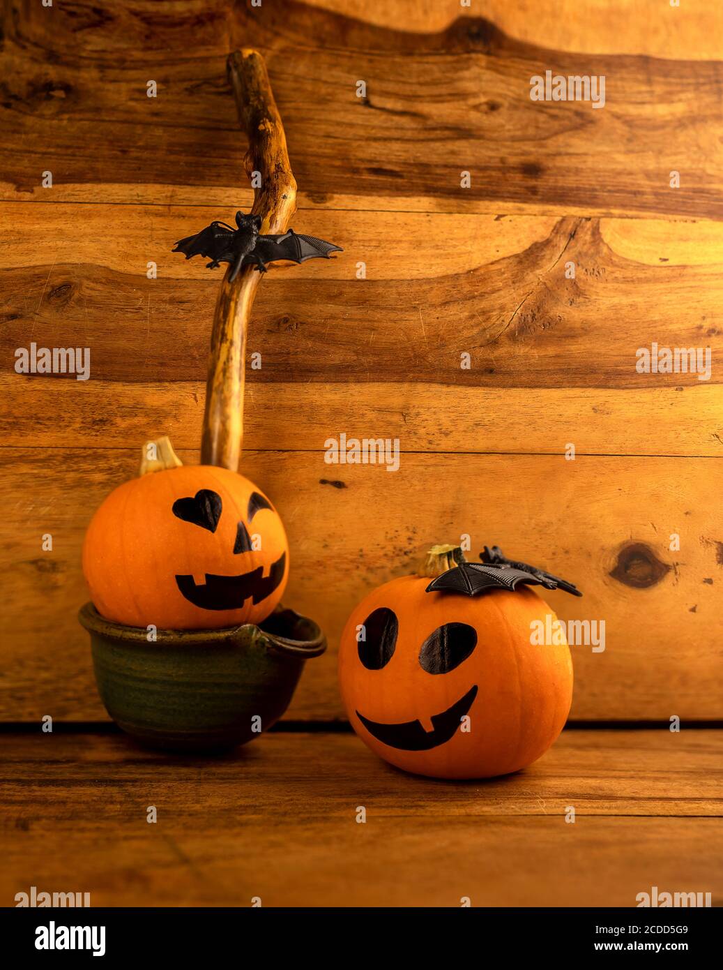 Little Pumpkins With Painted Faces For Halloween On Wooden Background Stock Photo Alamy