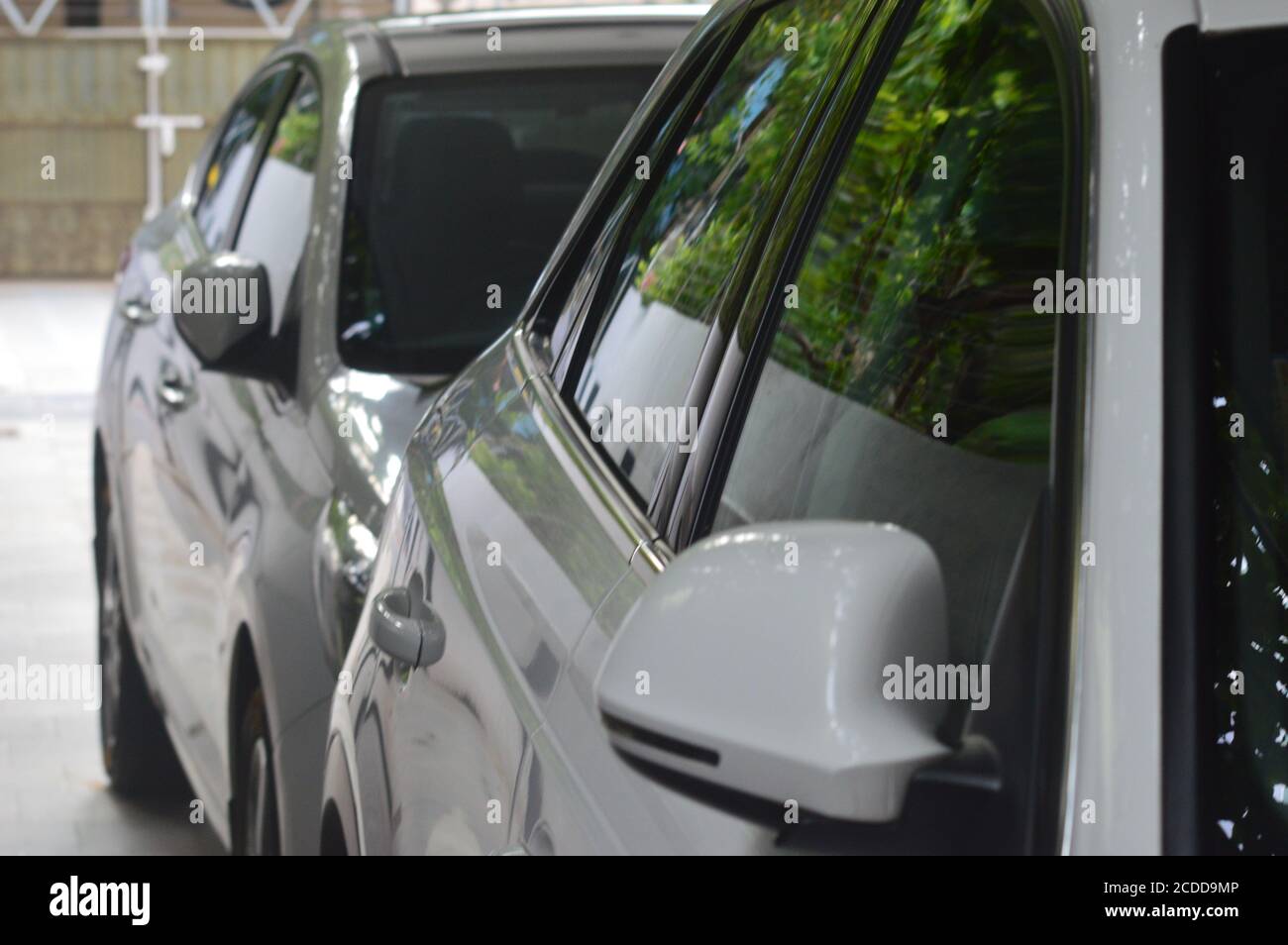 Luxury cars parked in a modern house in India Stock Photo