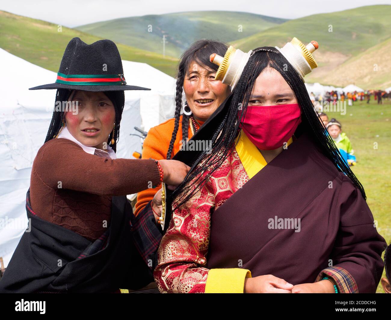 Kham people dressed up to participate in the the horse festival in a grassland near Litang city. Stock Photo