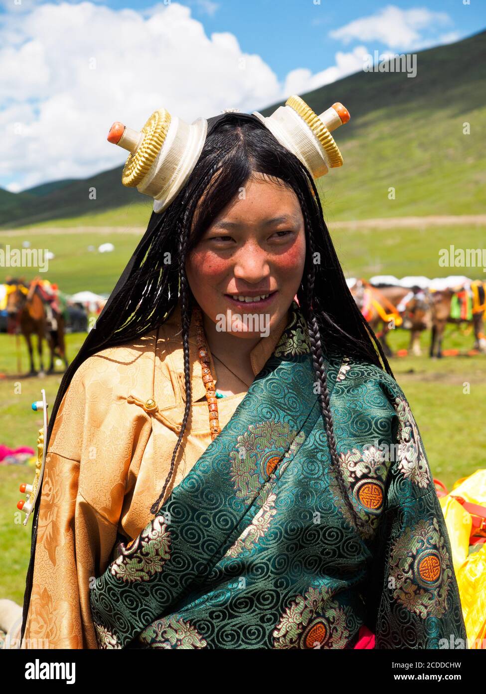 Kham people dressed up to participate in the the horse festival in a grassland near Litang city. Stock Photo