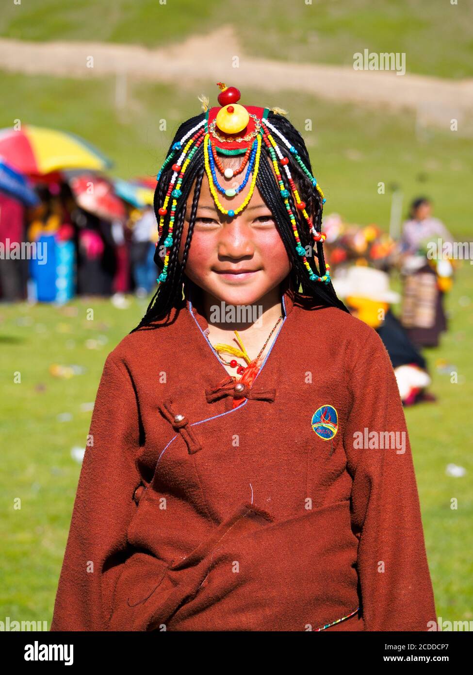 Kham people dressed up to participate in the the horse festival in a grassland near Litang city