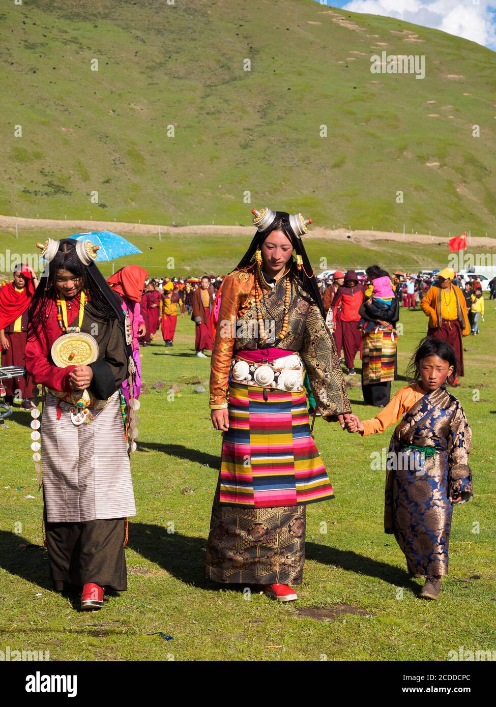 Kham people dressed up to participate in the the horse festival in a grassland near Litang city. Stock Photo
