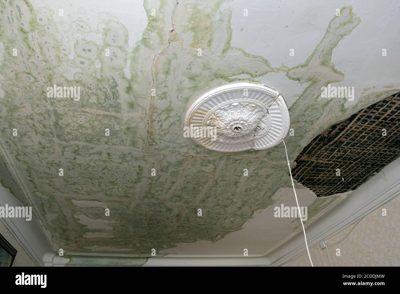 Damaged ceiling after a water pipe burst, vintage interior shot Stock