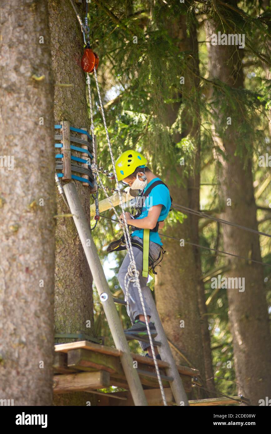 Boy wearing safety harness helmet hi-res stock photography and images ...