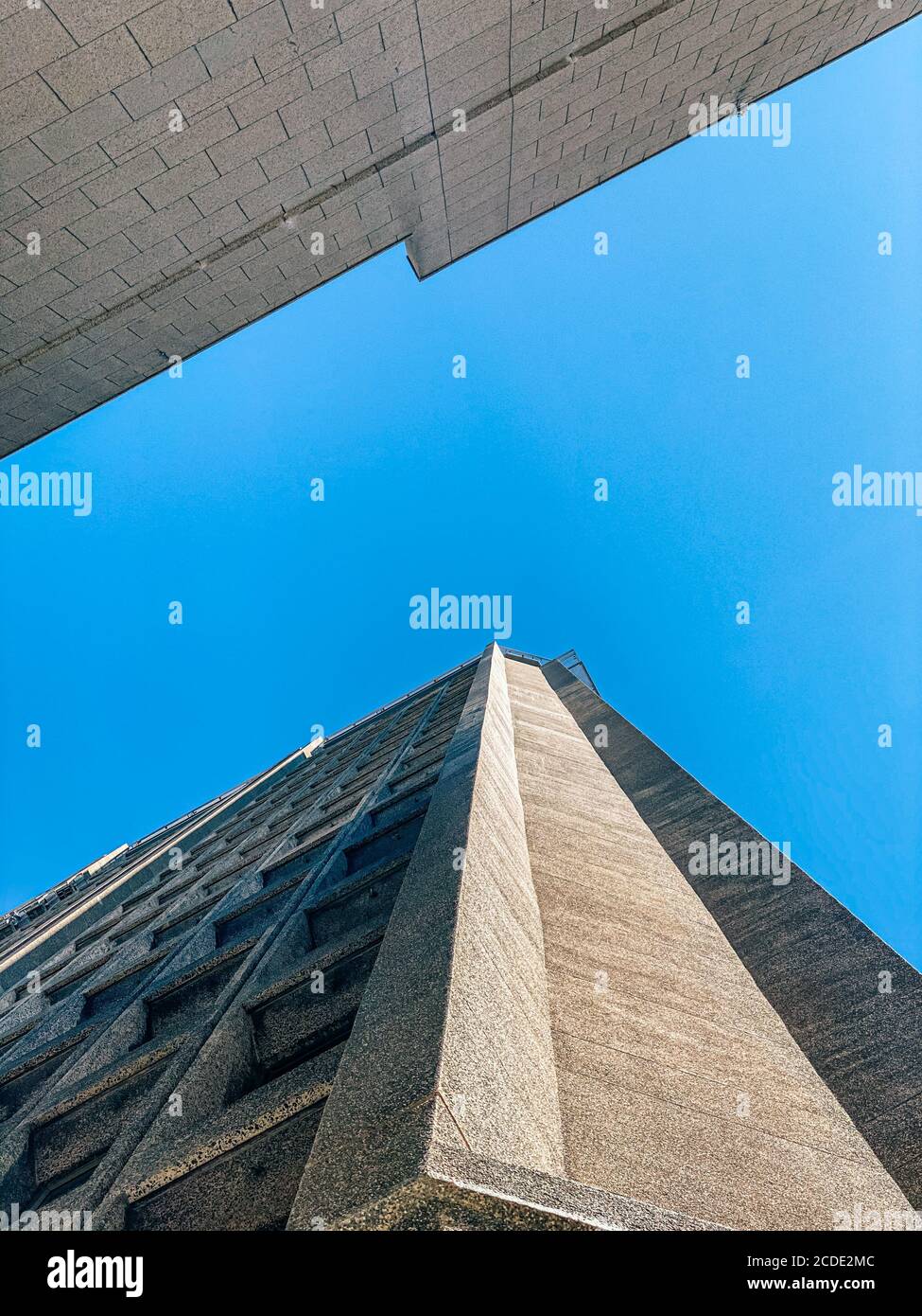 Vertical low angle shot of stone buildings under a clear sky Stock ...