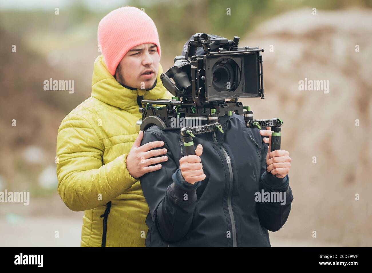 Behind The Scene Cameraman And Assistant Shooting The Film Scene With Camera On Outdoor 4864