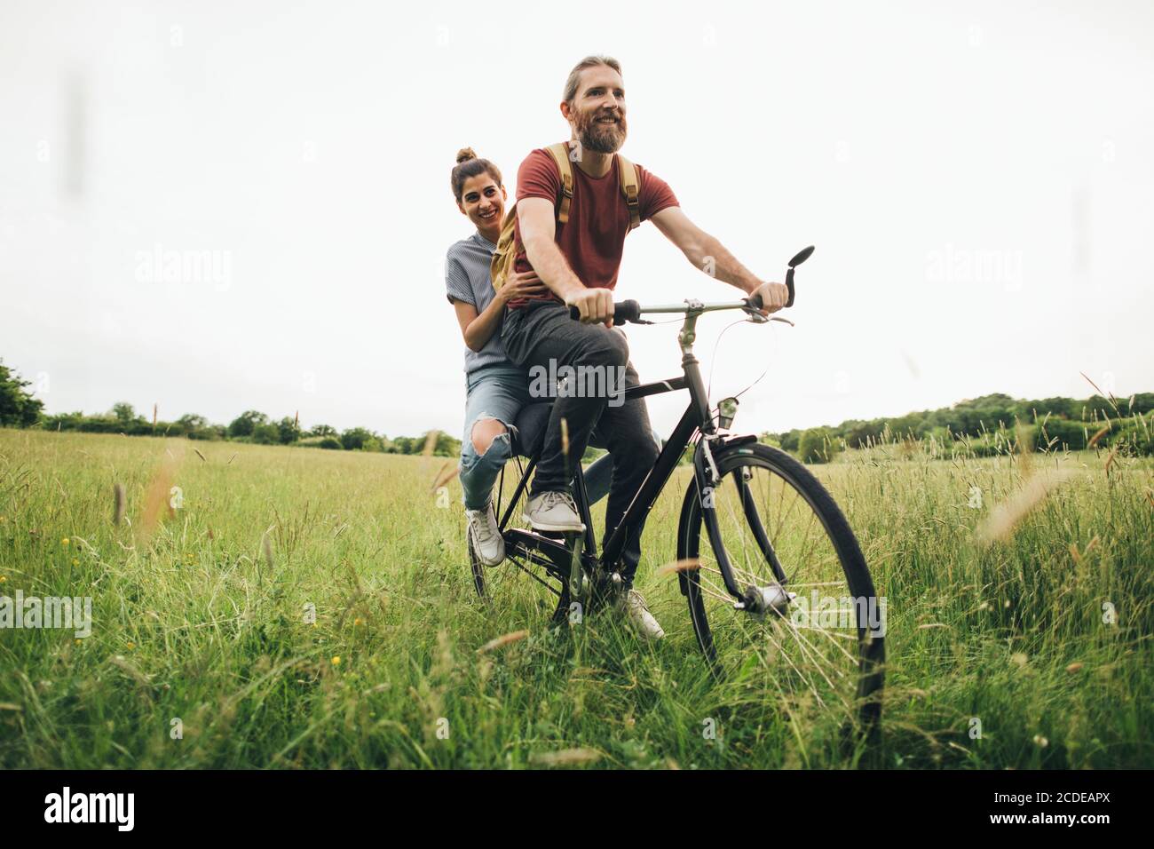 Male riding cycle smiling hi-res stock photography and images - Alamy