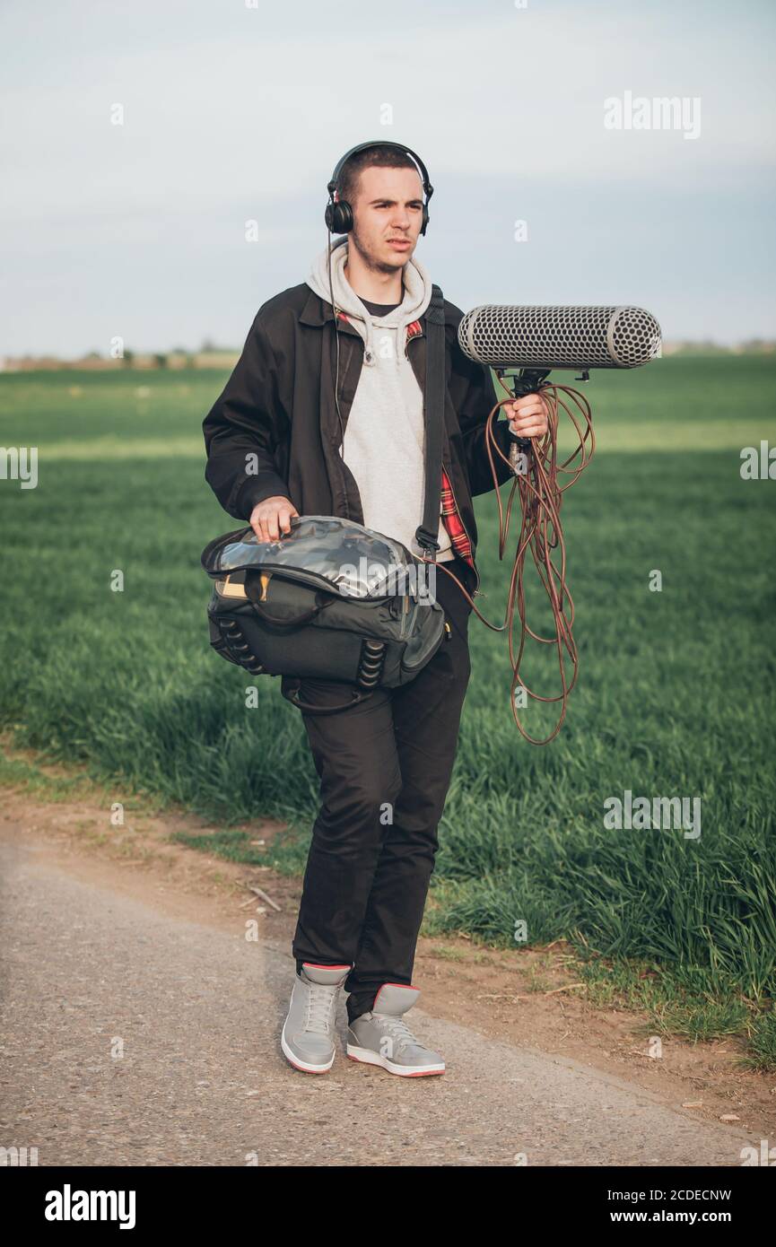 Behind the scene. Sound operator technician with boom microphone on the