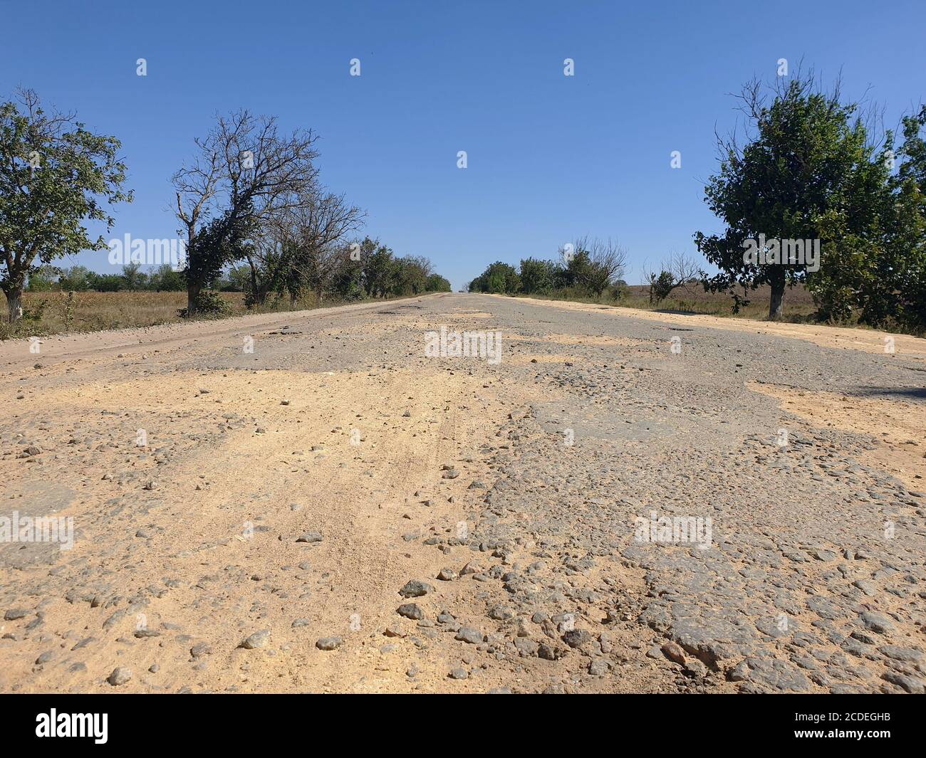 Dangerous road, potholes in the asphalt on the road Stock Photo