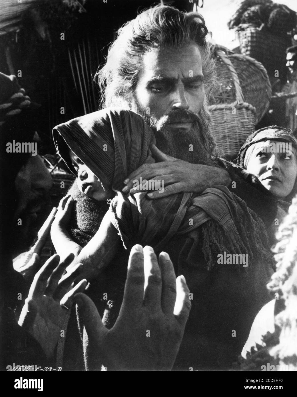 CHARLTON HESTON as Moses carrying baby child in Exodus scene from THE TEN  COMMANDMENTS 1956 director CECIL B. DeMILLE Motion Picture Associates /  Paramount Pictures Stock Photo - Alamy