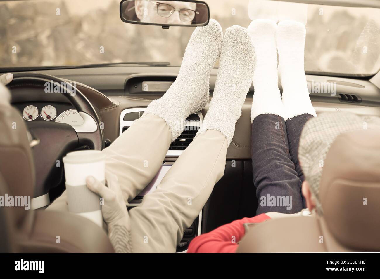 Relax time after a long trip. Without shoes and having a hot drink. Elderly  couple feeling as teenagers. Travelling and relax concept – Image Stock  Photo - Alamy