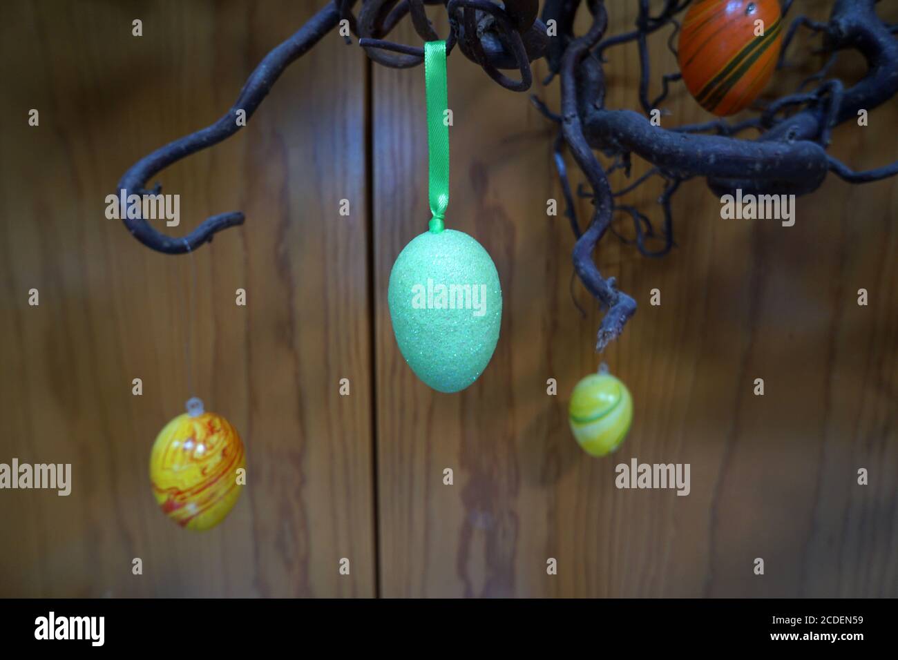 Colourful easter eggs hanging from the tree Stock Photo
