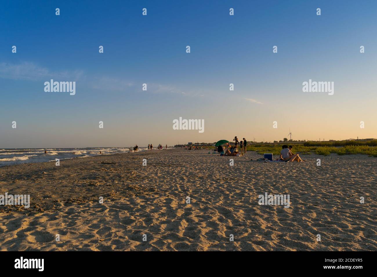 Corbu, Constanta, Romania - August 14, 2019: People enjoy a summer day sunset on the last virging beach in Corbu, Romania. Stock Photo