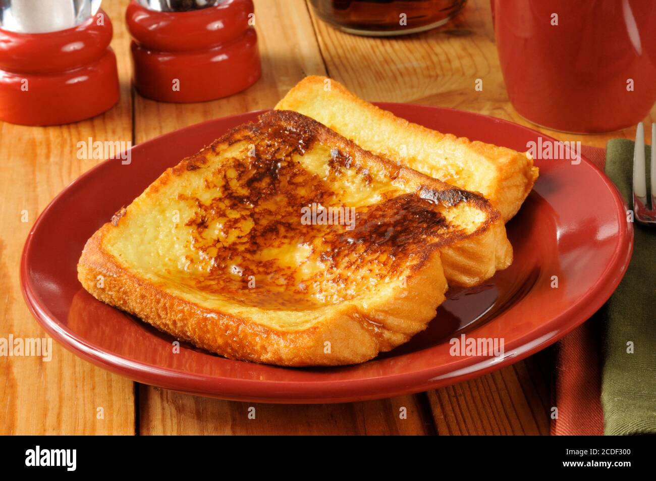 Buttery french toast with syrup from thick Texas toast Stock Photo Alamy