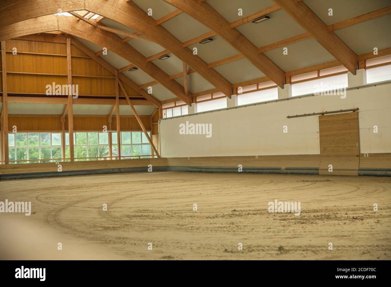 Empty indoor horse riding arena Stock Photo
