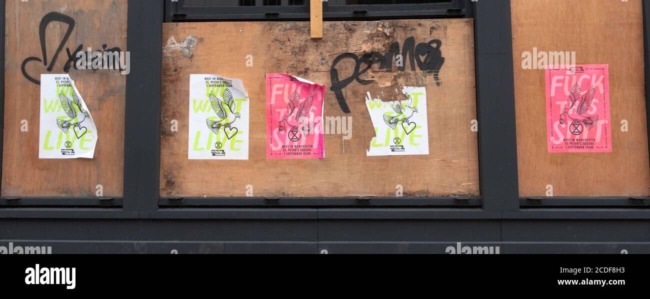 Posters advertising an Extinction Rebellion protest in Manchester, England, UK Stock Photo