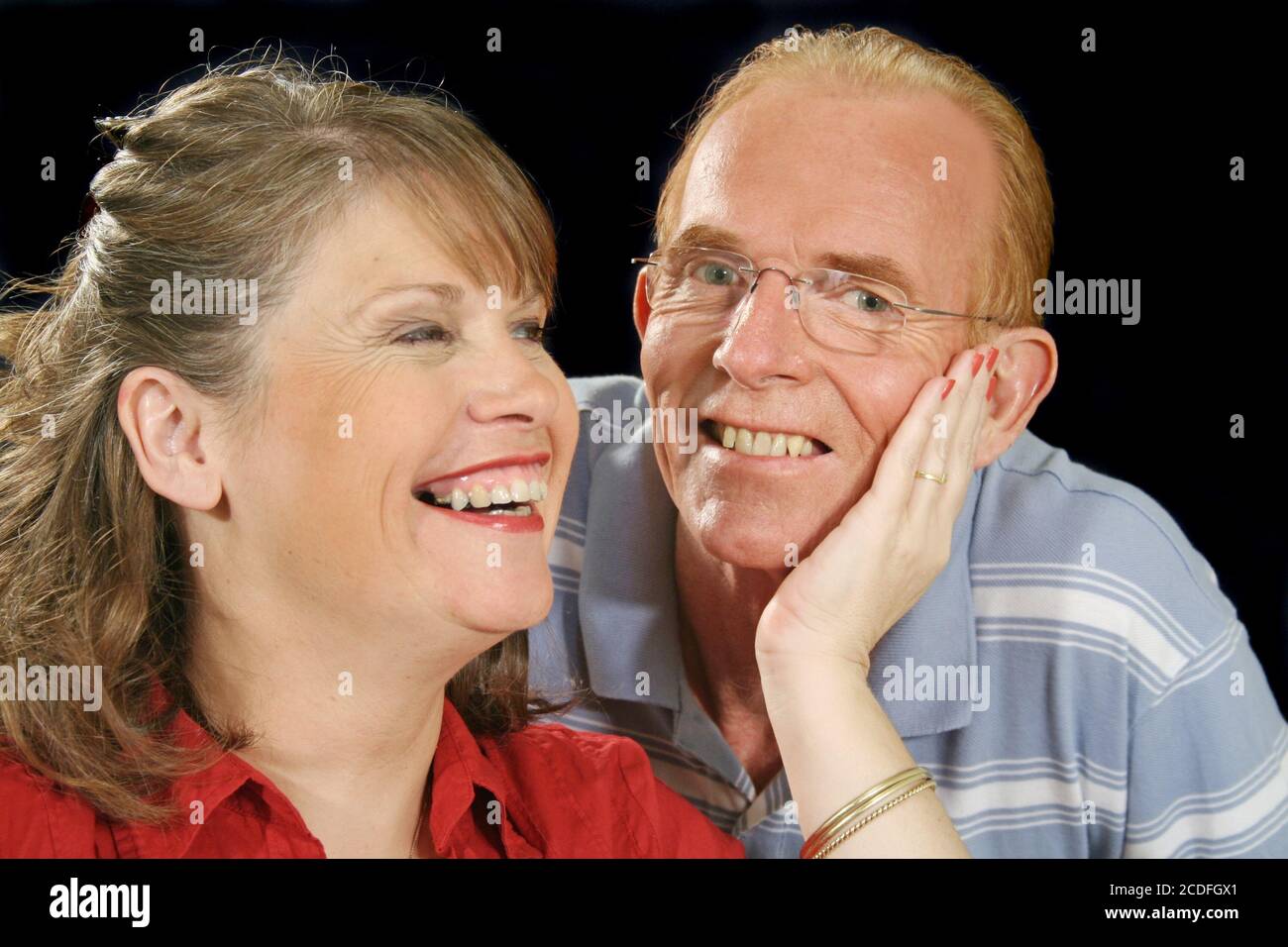 Middle Aged Couple Holding Stock Photo