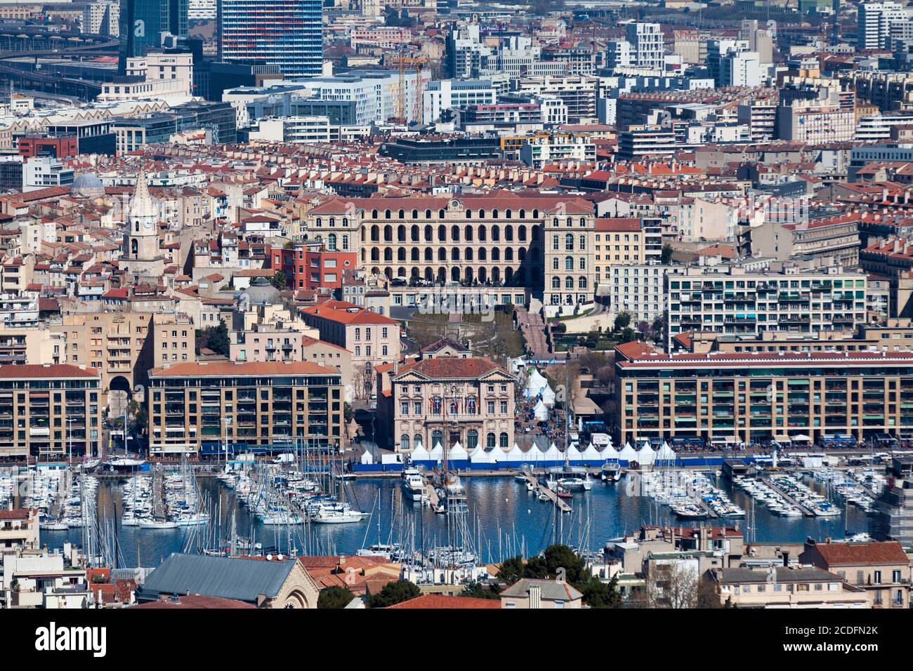 Marseille, France - March 23 2019: Aerial view of the Vieux Port with the Mairie de Marseille (English: City Hall), the Église des Accoules (English: Stock Photo