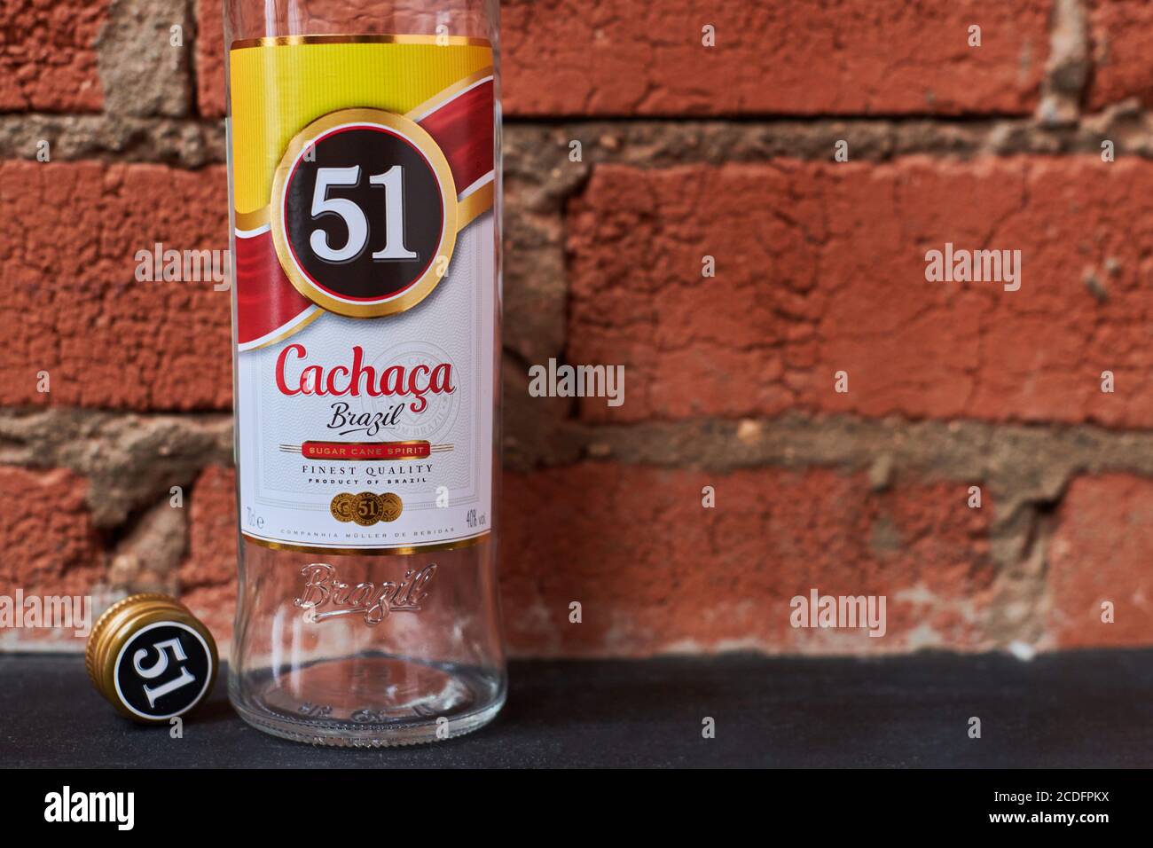 Moscow - 23.11.2019 - Cachaca 51 bottle. Brazilian rum. Exotic Brazil  strong alcohol drink rom fermented sugarcane juice. Loft apartment  background Stock Photo - Alamy