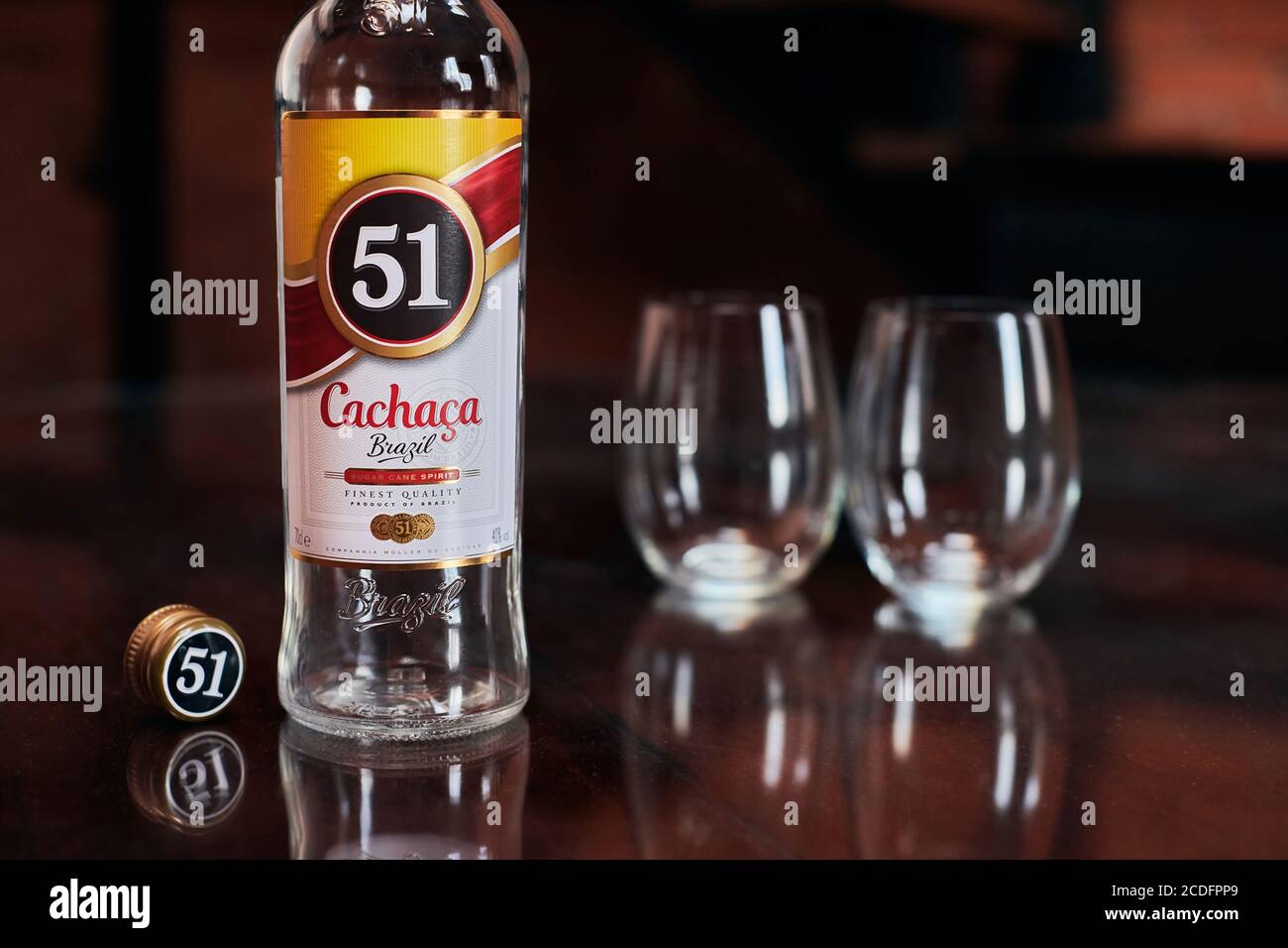 Moscow 23.11.2019 Cachaca 51 bottle with two glasses. Brazilian rum. Exotic Brazil strong