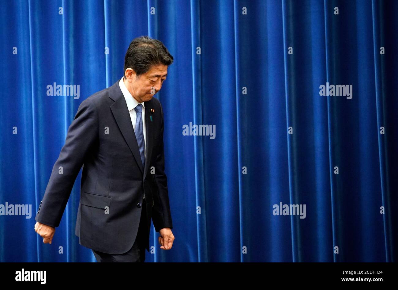 Tokyo, Japan. 28th Aug, 2020. Japanese Prime Minister Shinzo Abe leaves after a press conference in Tokyo, Japan, Aug. 28, 2020. Japanese Prime Minister Shinzo Abe said at a press conference Friday that he would step down from his post due to health concerns. (Franck Robichon/Pool via Xinhua) Credit: Xinhua/Alamy Live News Stock Photo
