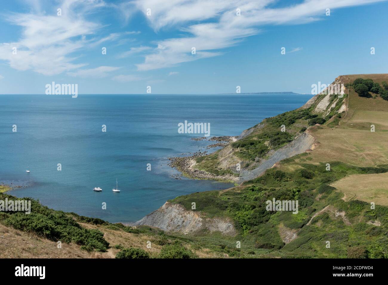 View looking down into "Chapman's Pool" in the Isle of Purbeck Dorset, seen from Emmett's Hill, with a view of Portland on the horizon to west. Stock Photo