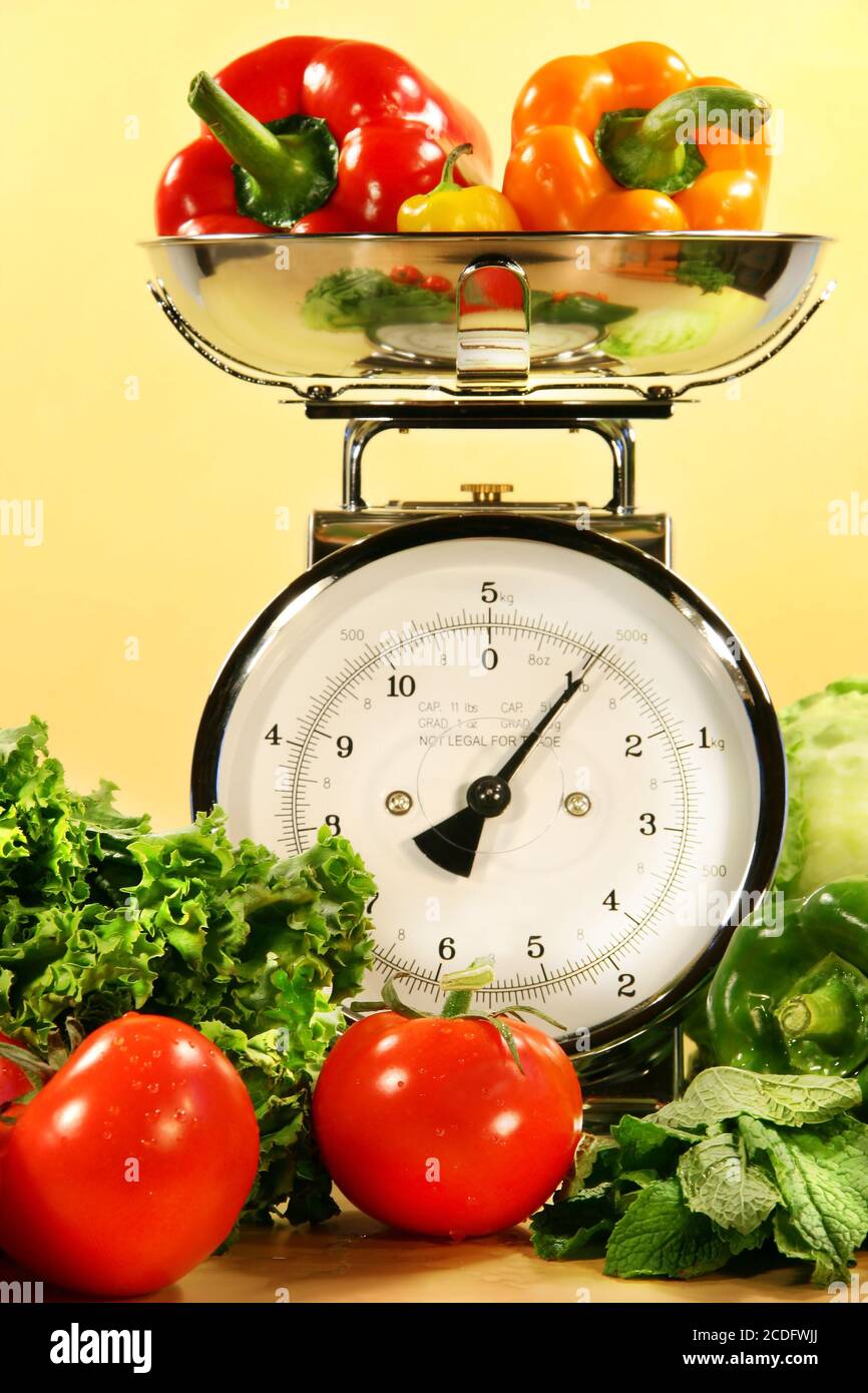 Vegetables on kitchen scale Stock Photo Alamy