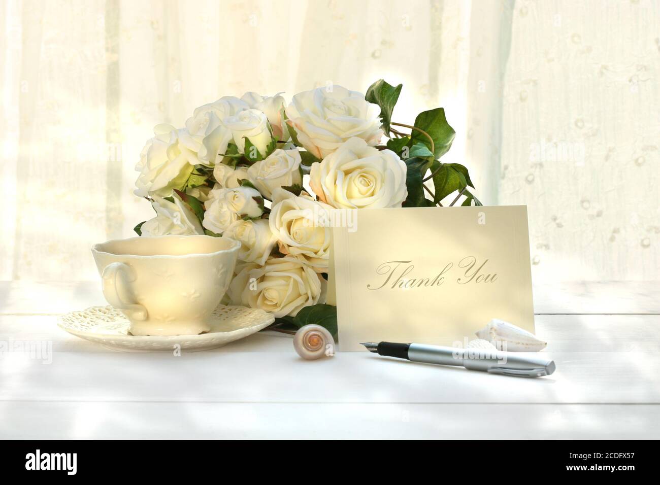 Writing thank you card with pen Stock Photo - Alamy