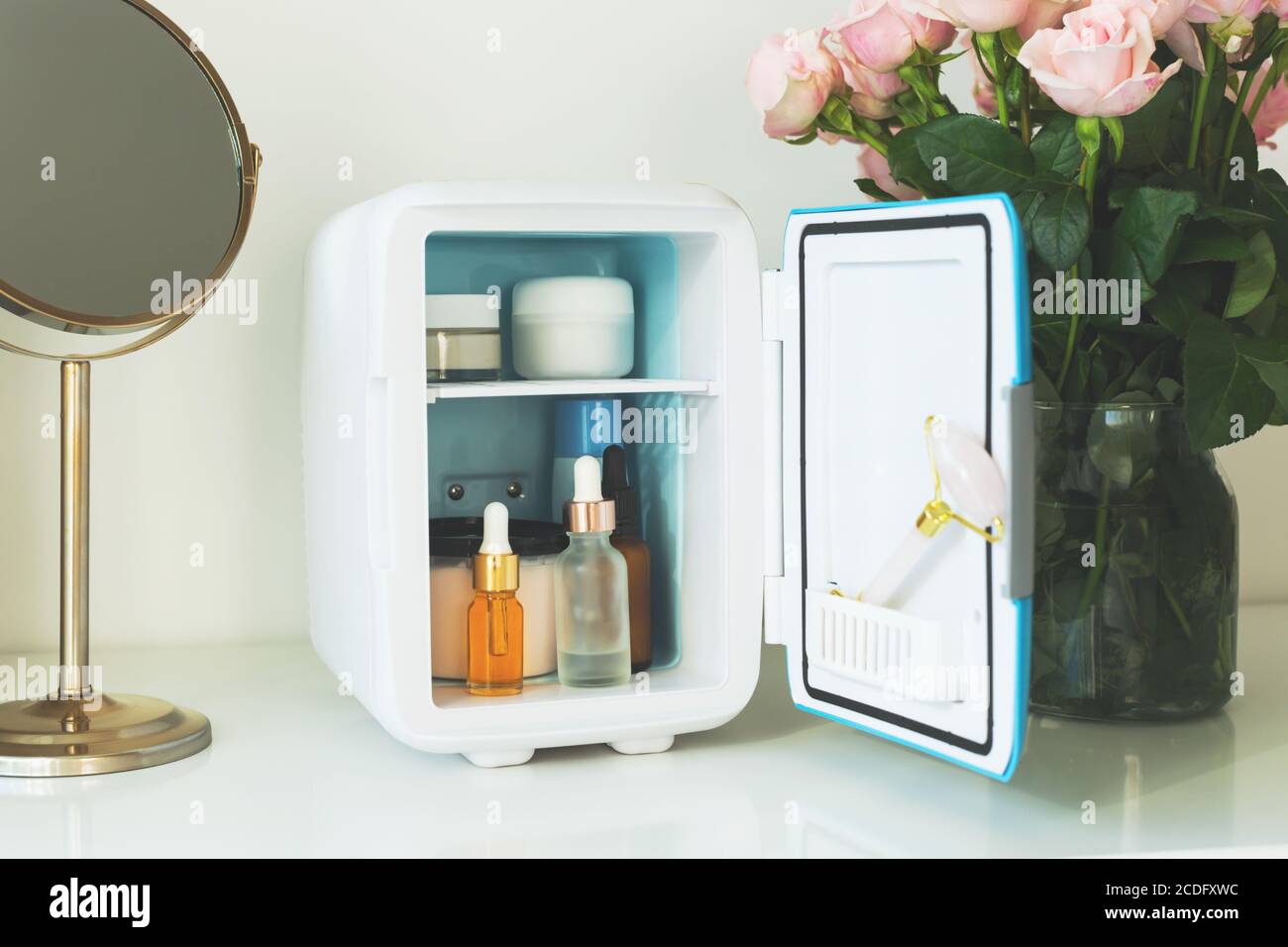 Mini fridge on the vanity table. Selfcare concept. Stock Photo