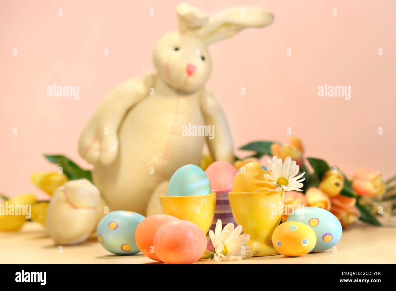 Colorful eggs for Easter with bunny Stock Photo - Alamy