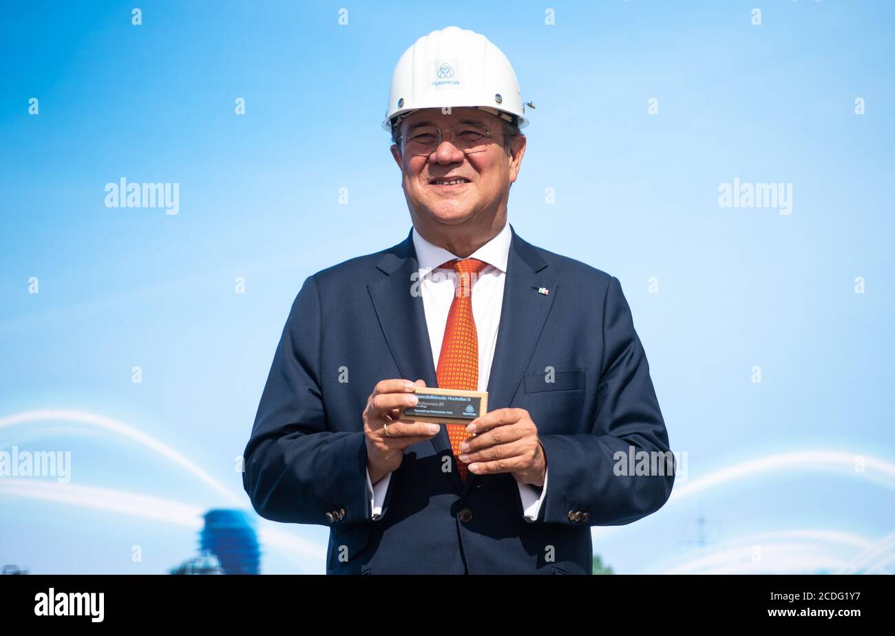 28 August North Rhine Westphalia Duisburg The Prime Minister Of North Rhine Westphalia Armin Laschet Cdu Visits The Steelworks Of Thyssenkrupp And Holds A Mini Slab In His Hands Thyssenkrupp Aims To Achieve