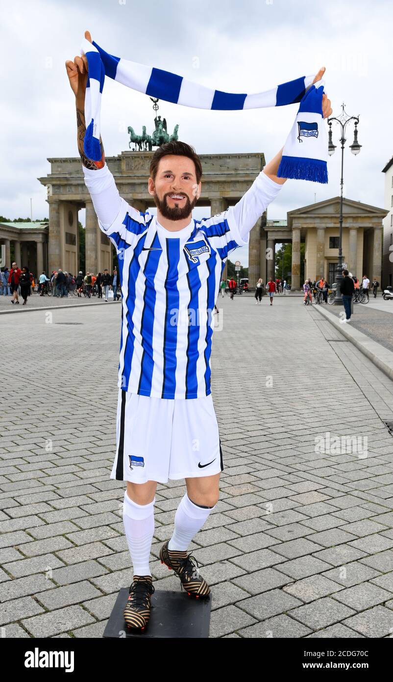Berlin, Germany. 28th Aug, 2020. Madame Tussauds has humorously placed the  wax figure of football star Lionel Messi in a jersey from the Berlin club  Hertha BSC in front of the Brandenburg